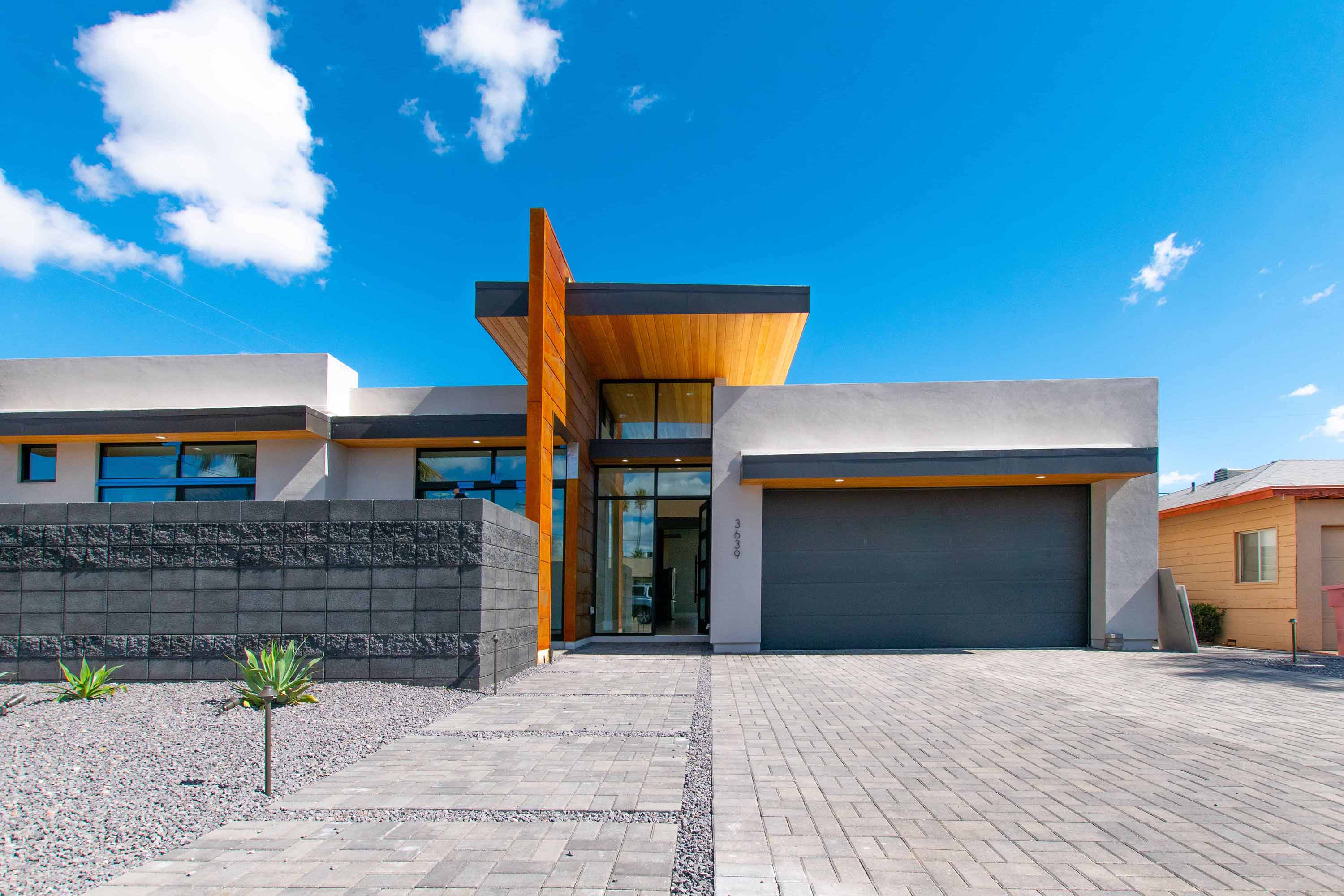 the front of a house with a modern style